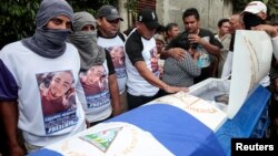 Demonstrators take part in funeral services of Agustin Ezequiel Mendoza, who was shot in recent protests against Nicaraguan President Daniel Ortega's government in Tipitapa, Nicaragua, June 15, 2018.