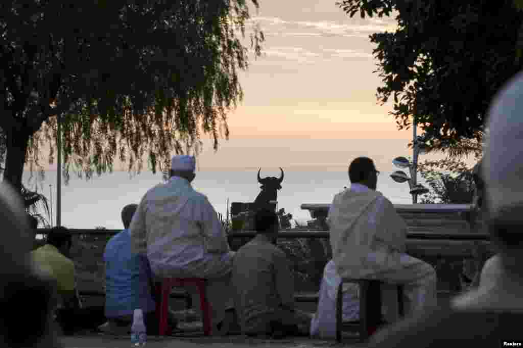 Muslims prepare to attend an Eid al-Adha mass prayer in Melilla, Spain, September 24, 2015.