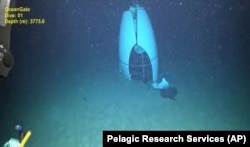 This June 2023 representation  provided by Pelagic Research Services shows remains of the Titan submersible connected  the level  of the Atlantic Ocean. (Pelagic Research Services via AP)