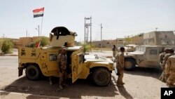 Iraqi security forces enter central Fallujah after fight against the Islamic State militants, Iraq, June 17, 2016.