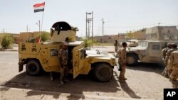 Iraqi security forces enter central Fallujah after fight against the Islamic State militants, Iraq, June 17, 2016.