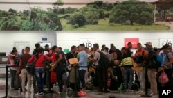 Cuban migrants wait to check-in at the Daniel Oduber Quiros International Airport in Liberia, Costa Rica, Jan. 12, 2016.