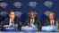 President of the African Development Bank Group Donald Kaberuka (C) addresses a news conference alongside Doug McMillon (L), president and CEO Wal-Mart International (L) and Bekele Geleta, Secretary-General of International Federation of Red Cross and Red