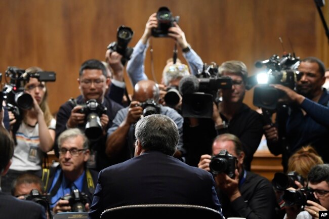 Attorney General William Barr is photographed as he sits down to testify before the Senate Judiciary Committee on Capitol Hill in Washington, May 1, 2019.