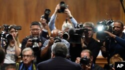 Attorney General William Barr is photographed as he sits down to testify before the Senate Judiciary Committee on Capitol Hill in Washington, May 1, 2019.