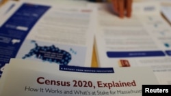 Informational pamphlets are displayed an event for community activists and local government leaders to mark the one-year-out launch of the 2020 Census efforts in Boston, Massachusetts, April 1, 2019. 