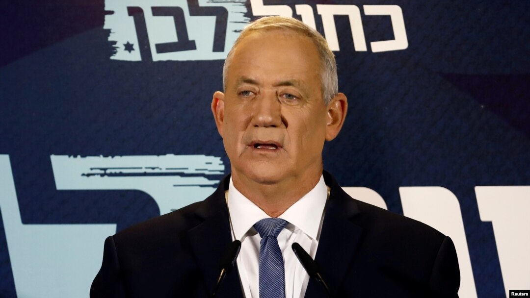 FILE - Benny Gantz, leader of Blue and White party, delivers a statement at the start of his party faction meeting in Tel Aviv, Israel, Sept. 26, 2019. 