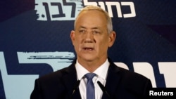 FILE - Benny Gantz, leader of Blue and White party, delivers a statement at the start of his party faction meeting in Tel Aviv, Israel, Sept. 26, 2019. 