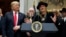 President Donald Trump looks on as musician Kid Rock speaks during a signing ceremony for the "Orrin G. Hatch Music Modernization Act," in the Roosevelt Room of the White House, Oct. 11, 2018, in Washington.