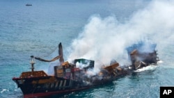 This photo provided by Sri Lanka's Air Force shows the sinking MV X-Press Pearl at Kapungoda where it was anchored off Colombo port, Sri Lanka, June 2, 2021.