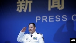 Qiu Yanpeng, deputy commander of the People's Liberation Army (PLA) Navy, arrives at a news conference ahead of the 70th anniversary of the founding of Chinese People's Liberation Army Navy, in Qingdao, China, April 20, 2019. 