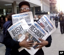 In this Nov. 8, 2000 photo, newspaper headlines reflect the suspense, drama and changes in following the presidential race between Vice President Al Gore and Texas Gov. George W. Bush.