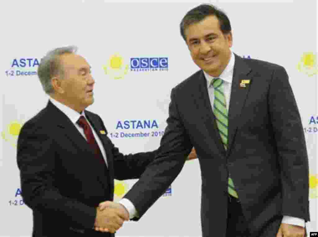 Kazakhstan's President Nursultan Nazarbayev, left, welcomes Georgian President Mikhail Saakashvili in Astana, Kazakhstan's capital at a start of OSCE (Organisation for Security and Cooperation in Europe) meeting on Wednesday, Dec. 1, 2010. The group unit