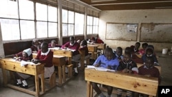 Pupils at the Toi Primary School in Nairobi, Kenya, sit in a classroom and study, September 6, 2011.