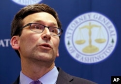 Washington Attorney General Bob Ferguson speaks at a news conference in Seattle about a federal appeals court's refusal to reinstate President Donald Trump's ban on travelers from seven predominantly Muslim nations, Feb. 9, 2017.