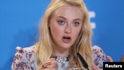 FILE - Actress Dakota Fanning attends a press conference to promote the film American Pastoral at TIFF the Toronto International Film Festival in Toronto, Sept. 10, 2016.