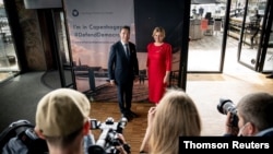 Former NATO chief Anders Fogh Rasmussen poses with Slovak President Zuzana Caputova as she arrives for the Copenhagen Democracy Summit, in Copenhagen, Denmark, May 10, 2021. 