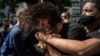 Plainclothes police detain an anti-government protester during a protest in Havana, Cuba, July 11, 2021.