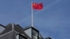 FILE - A Chinese national flag flies above China's Embassy in London, Sept. 11, 2023.