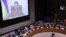 Ukrainian President Volodymyr Zelenskiy appears on a screen as he addresses the United Nations Security Council via video link during a meeting at the United Nations Headquarters in New York, April 5, 2022.