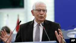 FILE: EU's head of foreign policy Josep Borell delivers a speech during a debate on the conclusions of the European Council meeting of March 24-25 2022.