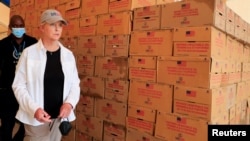 Cindy McCain, US ambassador to the U.N. Agencies in Rome, inspects relief items donated by USAID at the World Food Program warehouse, during her visit at the Kakuma refugee camp in Turkana county, Kenya, March 17, 2022. 