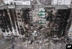 FILE - An apartment building is seen heavily damaged following a Russian attack in the center of Borodyanka, Ukraine, April 6, 2022.