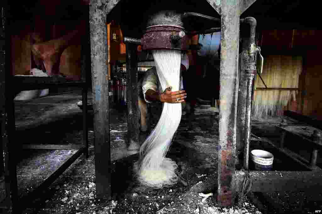 A worker prepares vermicelli, which is used in making traditional sweet dishes popularly consumed during the holy month of Ramadan, at a factory in Allahabad, India.