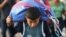 A Honduran migrant boy carries a bag as he takes part in a caravan heading to the US on the road linking Ciudad Hidalgo and Tapachula, Chiapas state, Mexico, Oct. 21, 2018. 