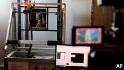 A Macro XRF scanner is used to study in minute detail the surface of Johannes Vermeer's masterpiece "Girl with a Pearl Earring", at the Mauritshuis museum in The Hague, Netherlands, Feb. 26, 2018. 
