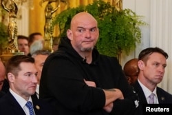 U.S. Senator John Fetterman, a Democrat, attends an event where President Donald Trump signed the Laken Riley Act, legislation requiring the detention of immigrants living in the U.S. illegally who are accused of a crime, at the White House in Washington on Jan. 29, 2025.