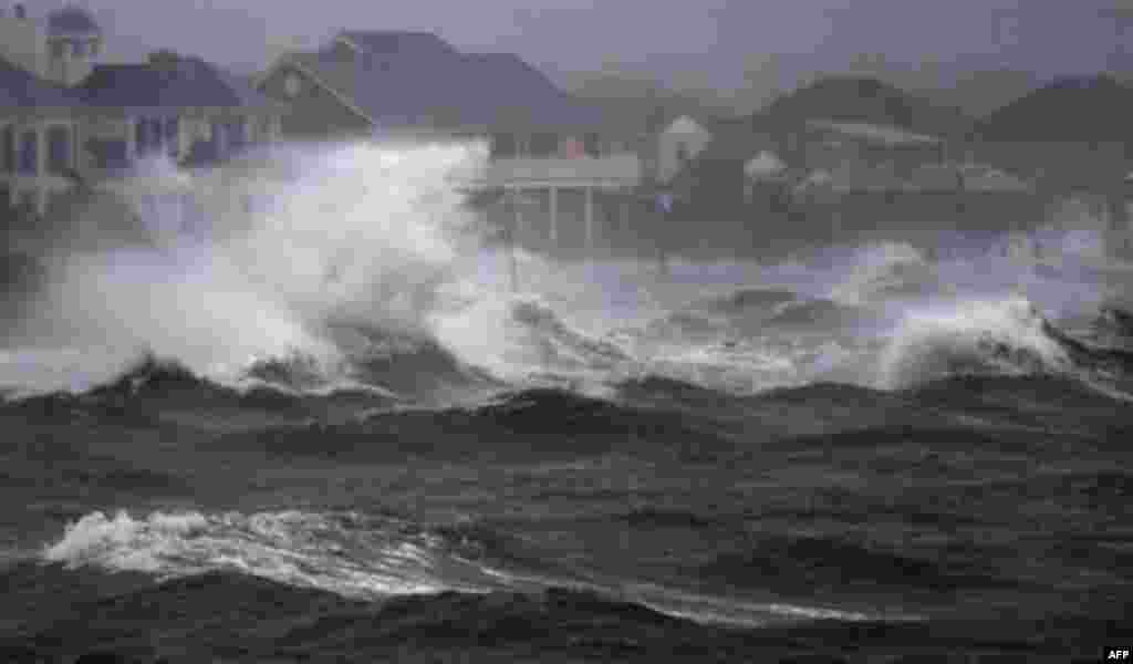 Waves crash over the shore during high tide during a storm surge from Hurricane Irene in Bayshore, N.Y., on Long Island, Sunday, Aug. 28, 2011. (AP Photo/Charles Krupa)