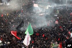 Mourners attend a funeral ceremony for Iranian Gen. Qassem Soleimani and his comrades, who were killed in Iraq in a U.S. drone strike on Friday, at the Enqelab-e-Eslami (Islamic Revolution) square in Tehran, Iran, Jan. 6, 2020.