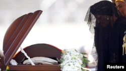 FILE: Former first lady of Zimbabwe, Grace Mugabe, pays her last respects during a state funeral of her husband and the country's longtime ruler Robert Mugabe, at the national sports stadium in Harare, Sept. 14, 2019. 