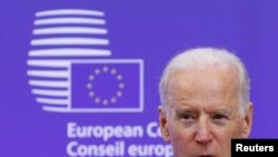 U.S. Vice President Joe Biden makes a joint statement with European Council President Donald Tusk ahead of a meeting at EU Council headquarters in Brussels February 6, 2015. Biden said on Friday that the United States and Europe needed to stand together…