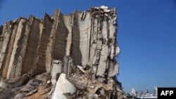 FILE - Damaged grain silos are seen at the port of the Lebanese capital Beirut, June 13, 2021, almost a year after the August 4 massive explosion.