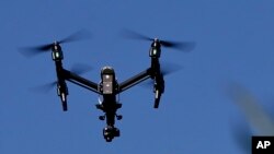 FILE - In this July 11, 2018 photo, s drone flies over the plants at the Pennsylvania Department of Natural Resources' Jennings Environmental Education Center in Slippery Rock, Pennsylvania.