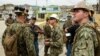 U.S. Marines and Navy corpsmen attached to the 26th Marine Expeditionary Unit and sailors assigned to Amphibious Construction Battalion 2 speak with local civilian employees during an assessment of Hospital Oriente’s needs as part of Hurricane Maria relief efforts in Humacao, Puerto Rico on Sept. 27, 2017.