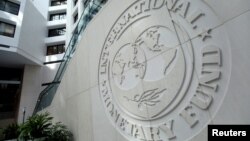 FILE - The International Monetary Fund logo is seen at its headquarters in Washington, Oct. 9, 2016. 