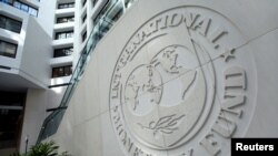 FILE - The International Monetary Fund logo is seen at its headquarters in Washington, Oct. 9, 2016. 