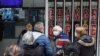 A customer leaves a currency exchange shop, in Ankara, on November 24, 2021. (Adem Altan/AFP)