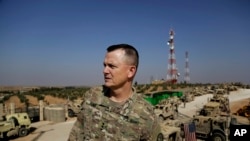 U.S. Army Lt. Gen. Paul E. Funk speaks to the Associated Press at an American outpost in the northern Kurdish town of Manbij, Syria, Feb. 7, 2018. The top U.S. general in the coalition fighting the Islamic State group pledged American troops would remain in the town despite Ankara's demands for a U.S. pullout. 