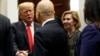 Deputy National Security Adviser Mira Ricardel, right, watches as President Donald Trump arrives for a Diwali ceremonial lighting of the Diya in the Roosevelt Room of the White House, Nov. 13, 2018, in Washington. 