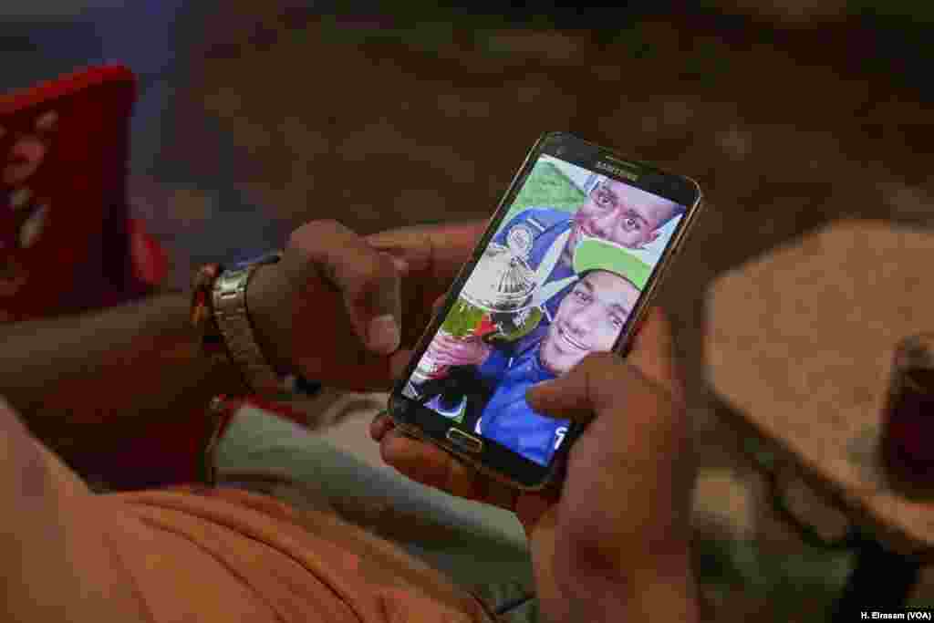 Nader Ashraf shows a picture of his championship trophy while playing with a Coptic team. “The only place that is welcoming Christian football players is the church, but the church’s potential to sponsor a (major) football team is very poor.” 