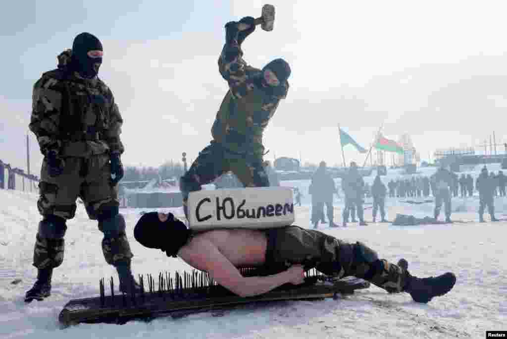 Special forces of Belarusian Defense Ministry perform to mark the Defender of the Fatherland Day at the "Stalin Line" memorial near the village of Goroshki.
