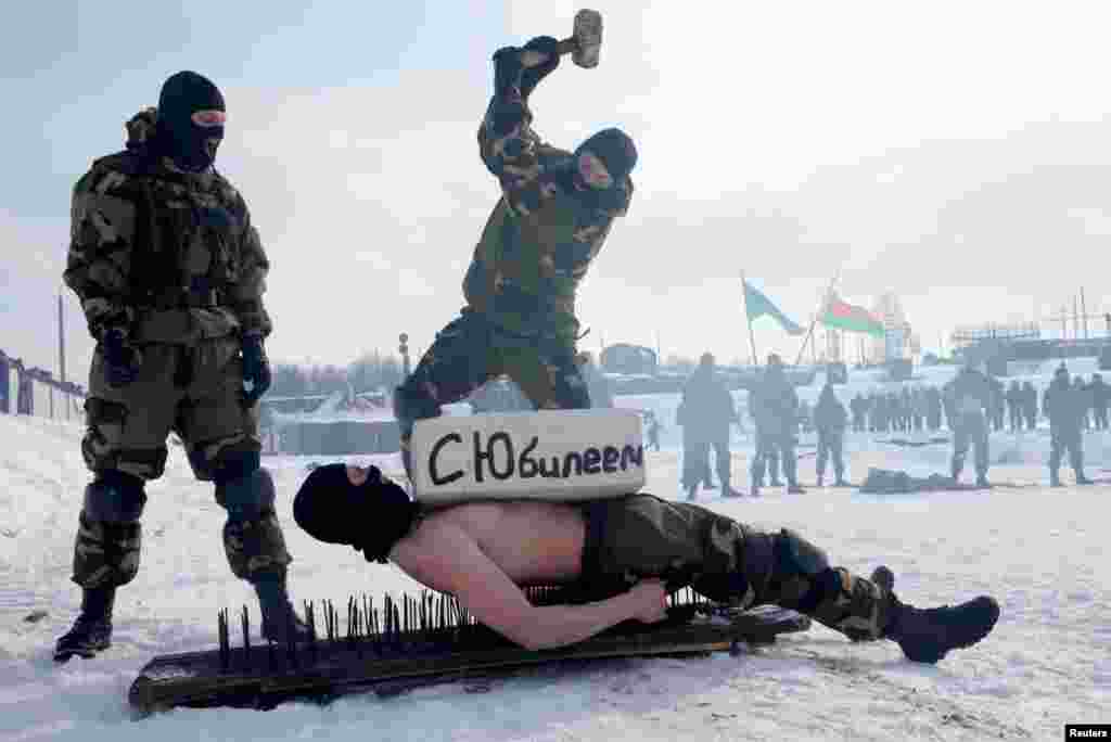 Special forces of Belarusian Defense Ministry perform to mark the Defender of the Fatherland Day at the &quot;Stalin Line&quot; memorial near the village of Goroshki.