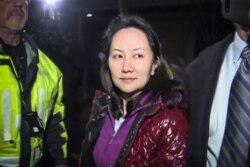 FILE - Huawei Technologies Chief Financial Officer Meng Wanzhou is pictured as she exits the court registry following a bail hearing at British Columbia Superior Courts in Vancouver, British Columbia, Dec. 11, 2018.