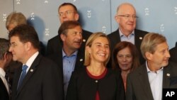 EU foreign policy chief Federica Mogherini , center, smiles, during the Informal Meeting of EU Foreign Ministers in Bratislava, Slovakia, Sept. 3, 2016. 