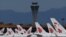 FILE - This photo taken March 27, 2020, shows Air China planes parked on the tarmac at Beijing Capital Airport. 