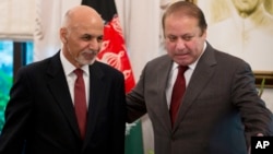 FILE - Pakistan's Prime Minister Nawaz Sharif, (r) invites visiting Afghan President Ashraf Ghani for talks at the prime minister house in Islamabad, Pakistan, Nov. 15, 2014.